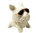 Cream French Bulldog tissue holder — front view on marble with gold-frame sunglasses