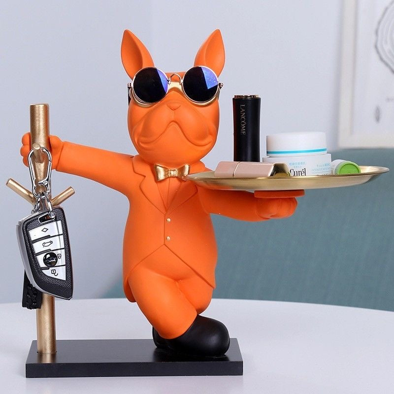 Orange tuxedo Frenchie key rack with gold tray and key hooks — lifestyle