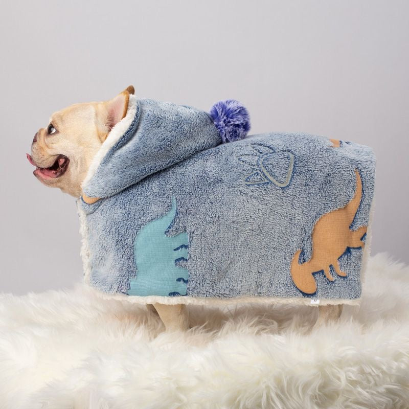 Blue dinosaur-print hooded pet cape — side view, size M tag
