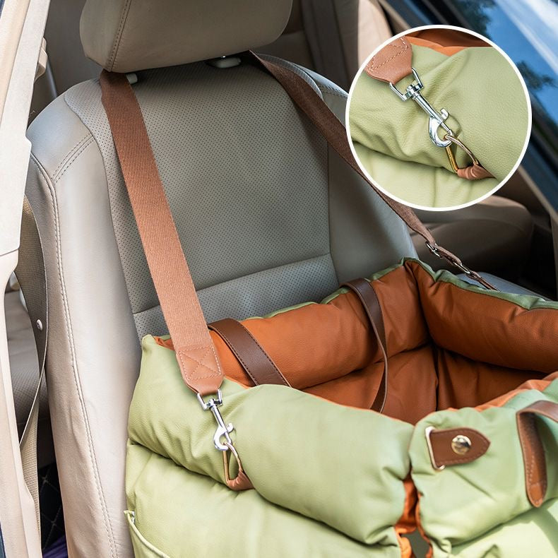 Olive booster carrier secured to a car headrest