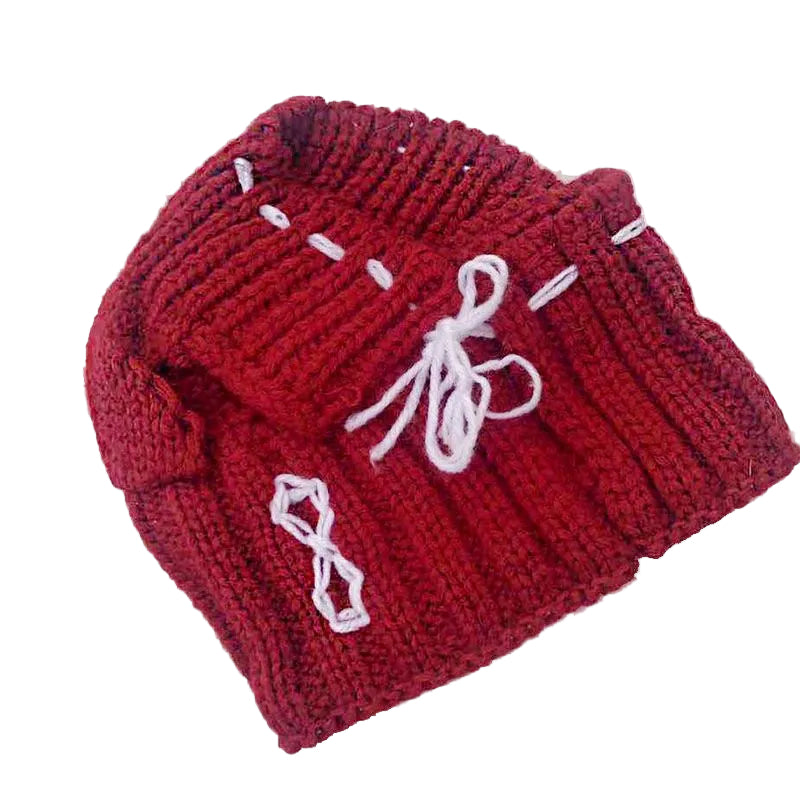 Red Frenchie knit pom-pom hat — close-up detail