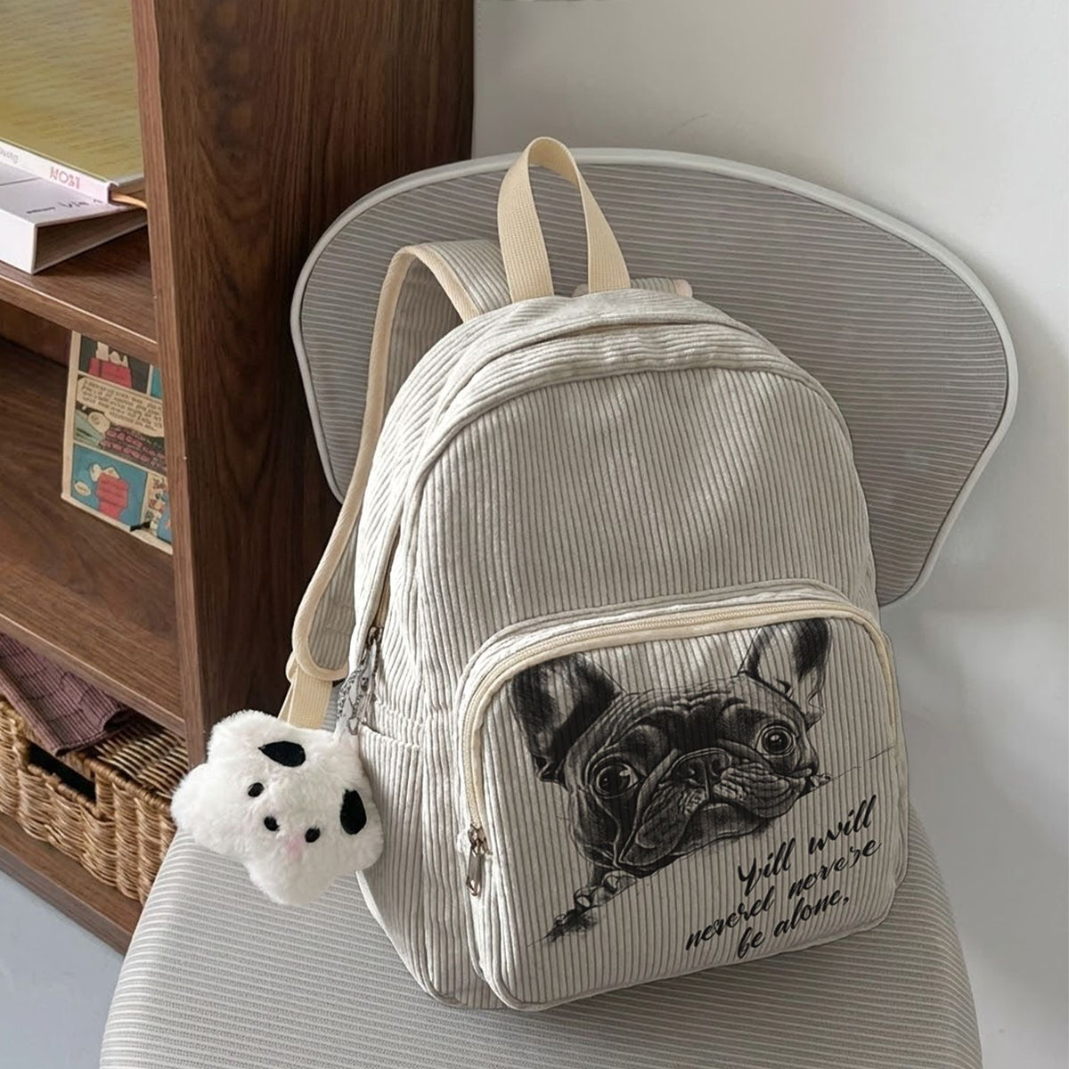 Cream Frenchie Corduroy Mini Backpack on chair — never-alone sketch print