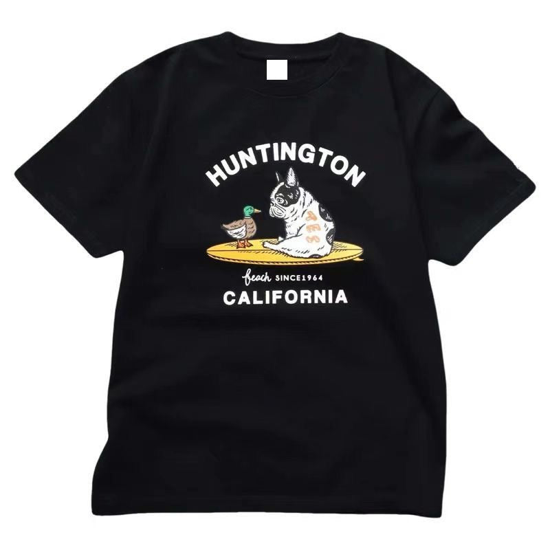 Black Huntington Beach Frenchie Tee — French Bulldog and duck on yellow surfboard