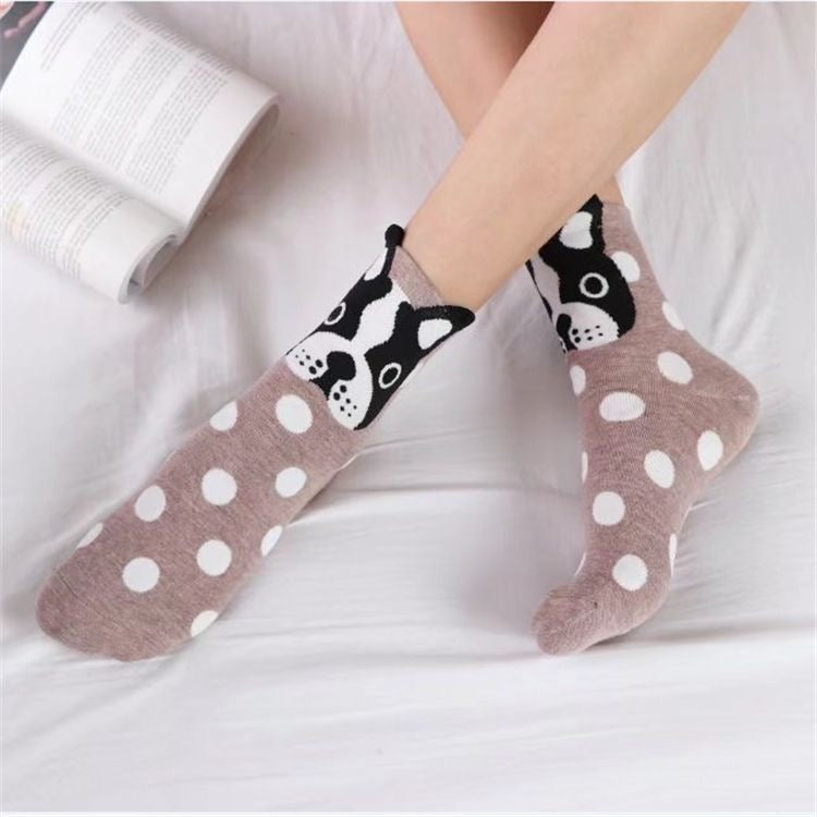Frenchie polka-dot crew socks with cartoon dog-face cuff — on-feet lifestyle