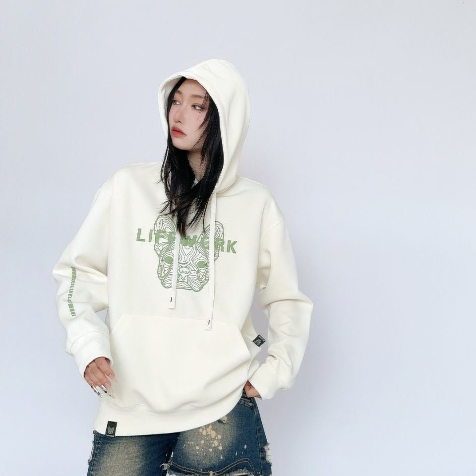 Cream oversized Cool Frenchie graphic hoodie — on model