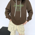 Brown oversized Cool Frenchie graphic hoodie — on model