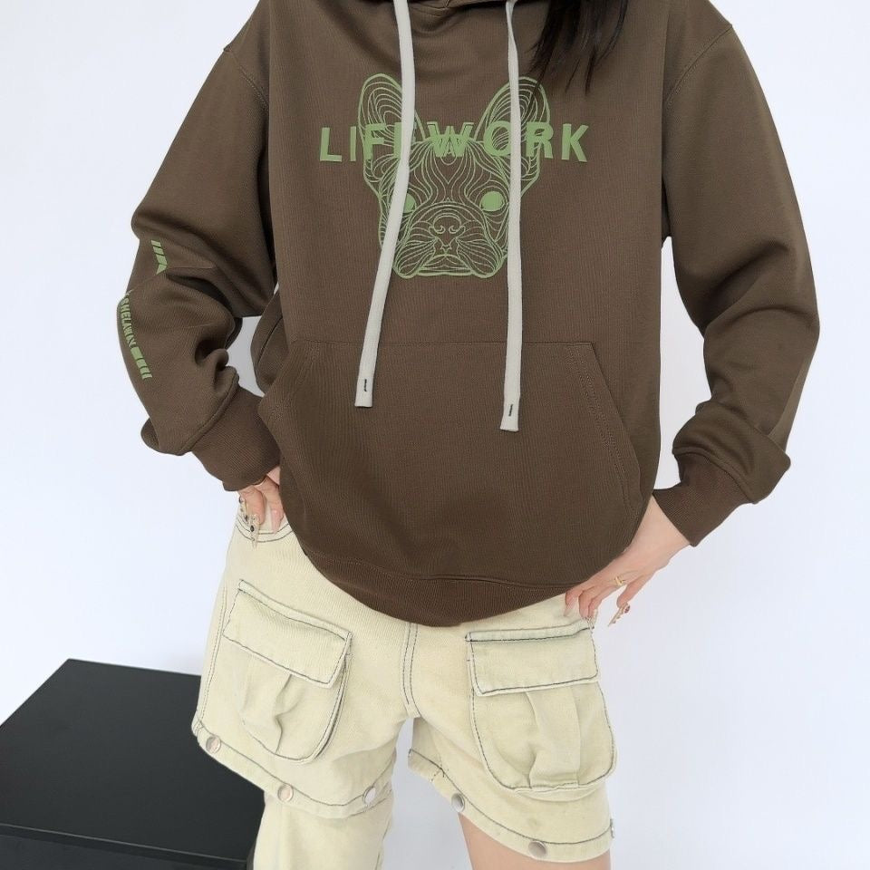 Brown oversized Cool Frenchie graphic hoodie — on model