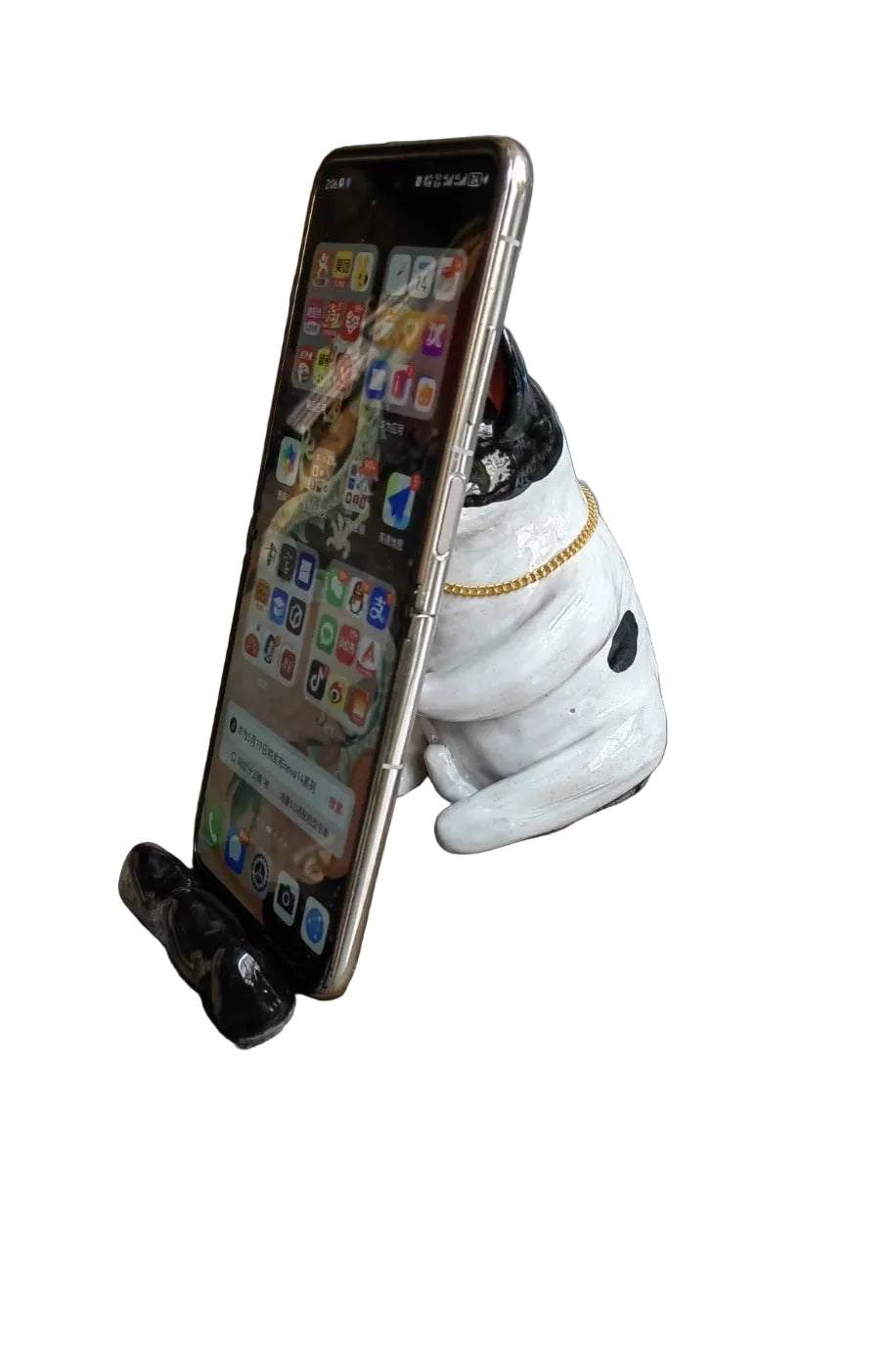 Frenchie ceramic phone stand holding a smartphone
